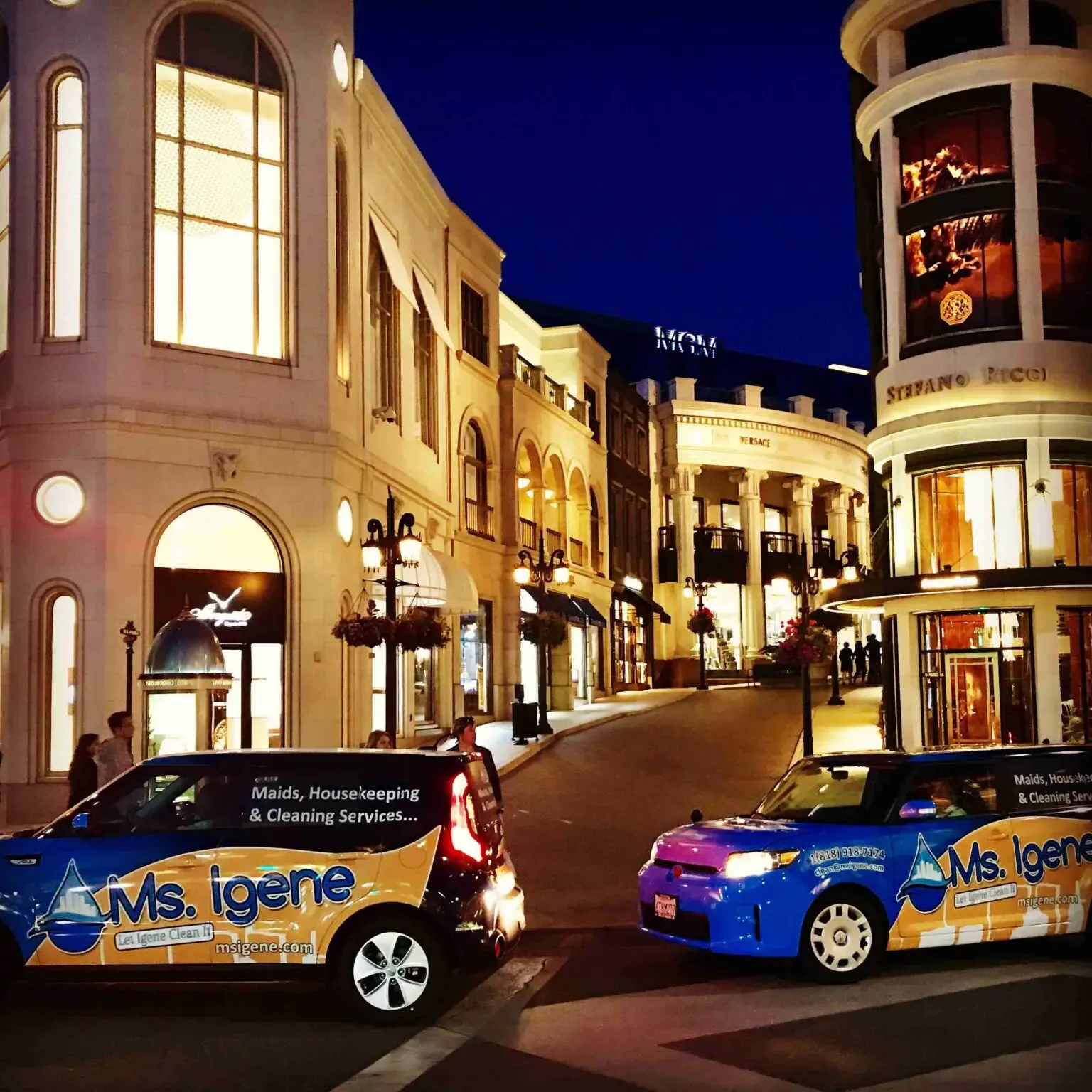 A couple of cars parked on top of the street.