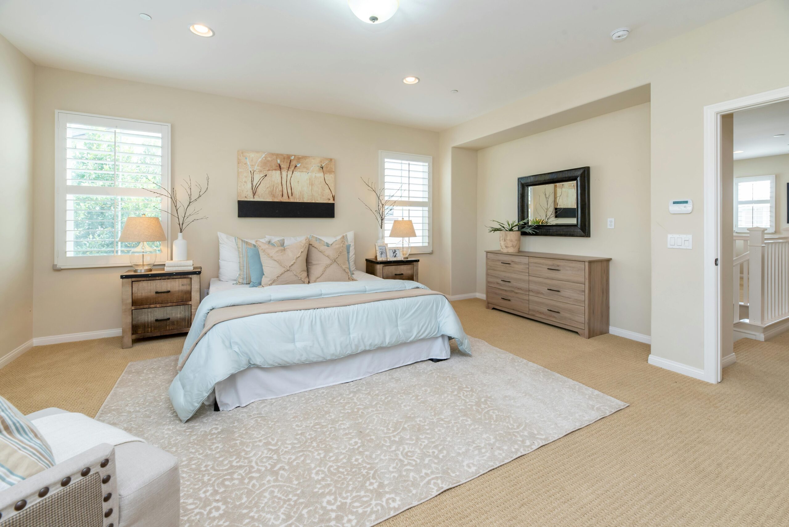 A bedroom with a large bed and a television.